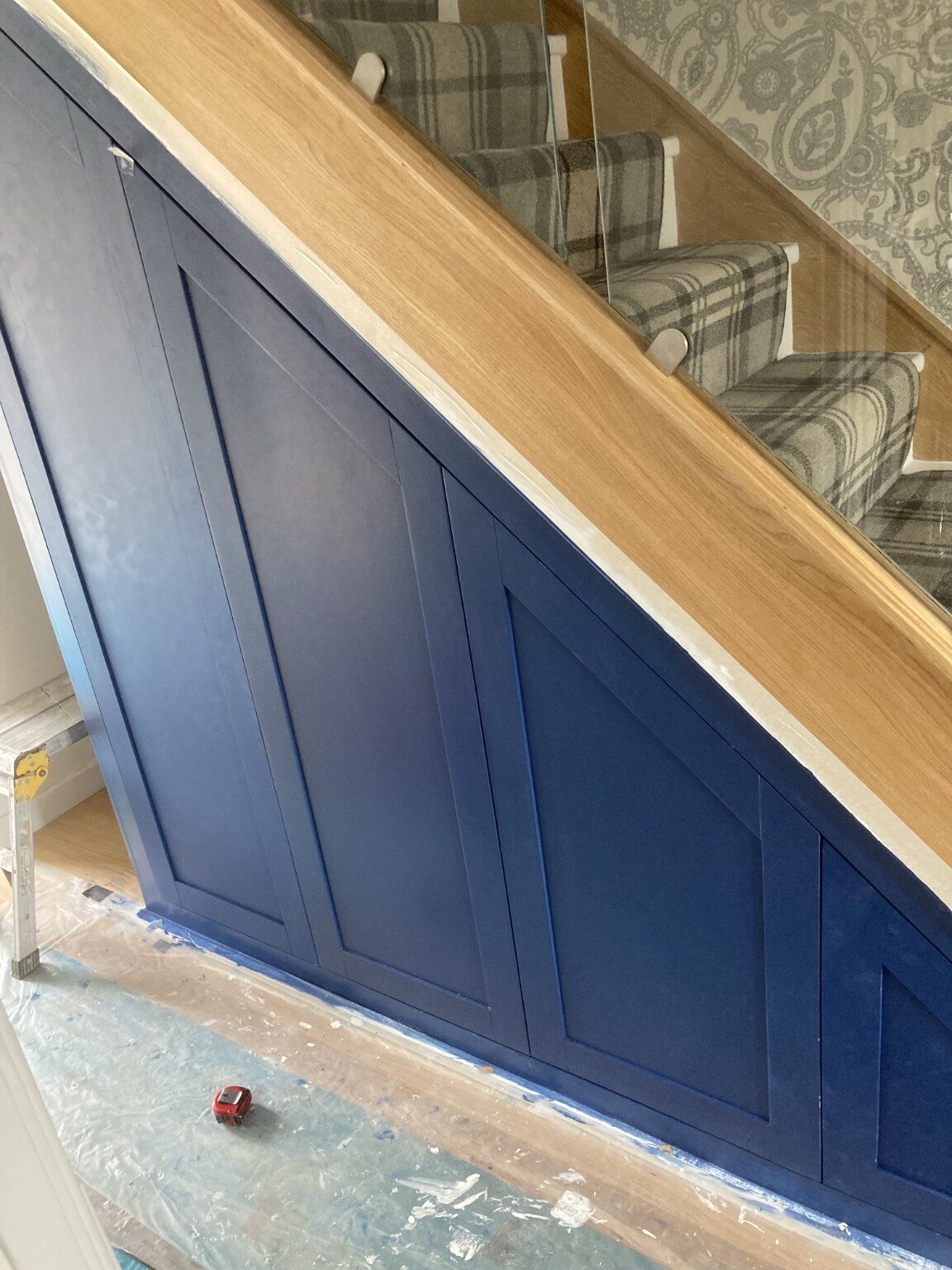 Panelled under-stairs cupboards